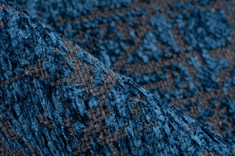 Nahaufnahme eines strukturierten Webstoffs mit weicher Oberfläche in Blau und Grau.