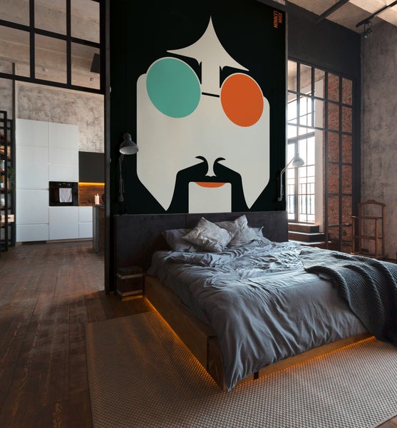 Schlafzimmer im Industriestil mit Wandbild von John Lennon, Podestbett aus Holz mit Beleuchtung und angrenzender moderner Küche.