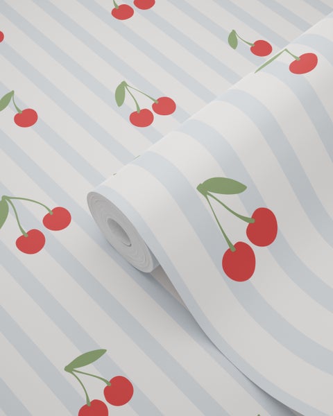 Küche mit Kirschmuster-Tapete, Spüle und grünen Schränken