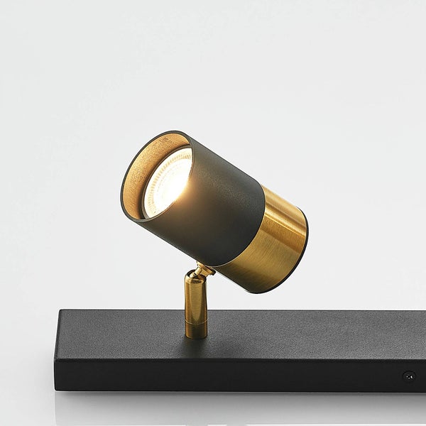 Schwarze und goldfarbene Spotleuchte