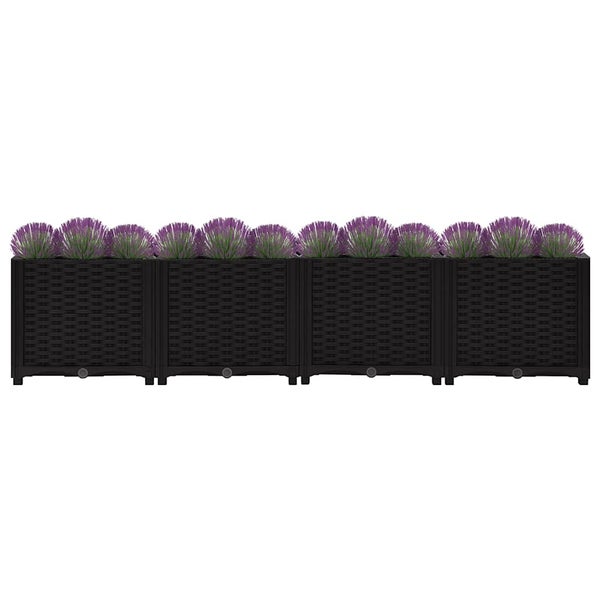 Rechteckiger Blumenkasten in Rattanoptik mit bepflanzten Lavendelbüscheln.