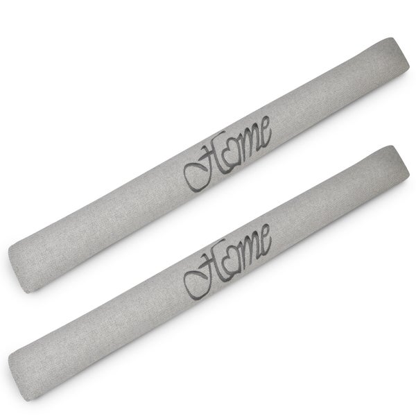 Zwei Zugluftstopper mit der Aufschrift Home.