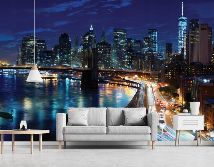 Fototapete mit New Yorker Skyline bei Nacht für eine lebendige Raumgestaltung