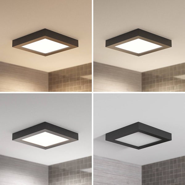 Quadratische LED-Deckenleuchte mit schwarzem Rahmen, zeigt vier Lichtstufen von warmweiß bis kaltweiß.