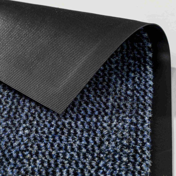 Detailansicht einer Fußmatte mit Textiloberfläche und rutschfester Rückseite