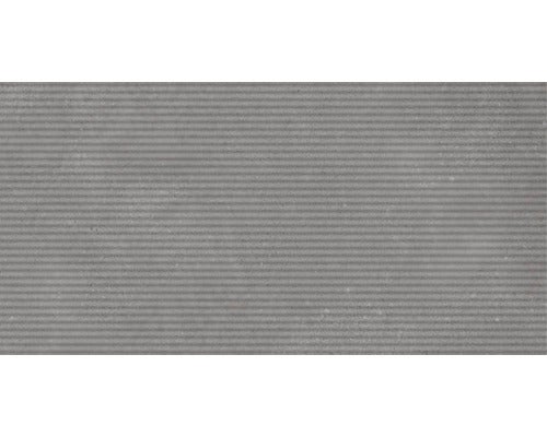 Graue Wandfliese mit gerippter Oberfläche.