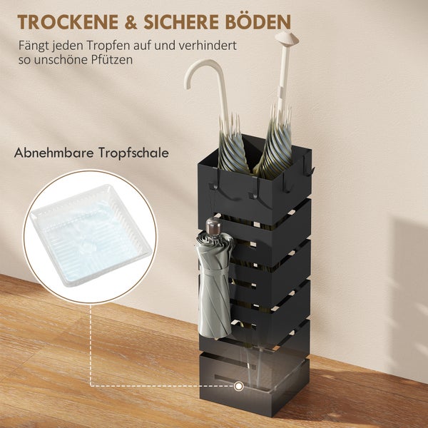 Moderner schwarzer Schirmständer aus Metall auf Holzfußboden mit abnehmbarer Tropfschale und Haken für Taschenschirme für einen organisierten Flur.