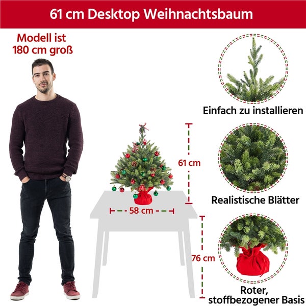 Dekorierter, kleiner Weihnachtsbaum auf einem Tisch mit Geschenken und Laptop, Details zu Material und flammhemmender Funktion