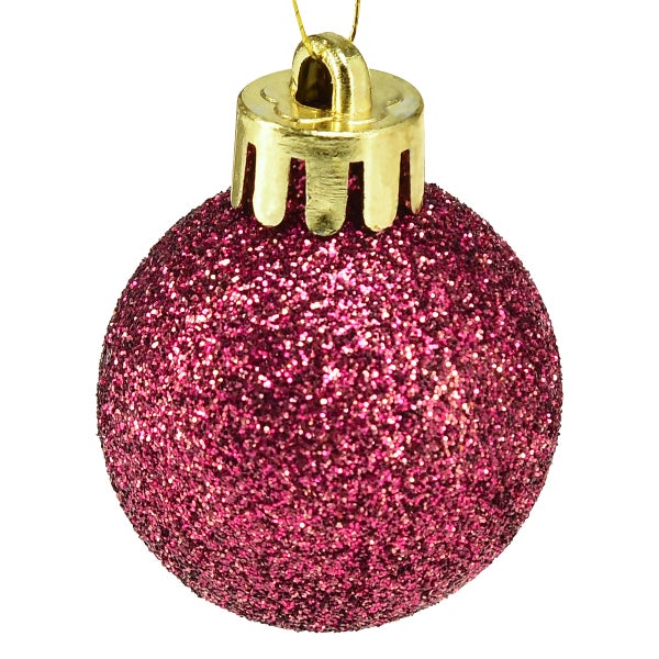 Funkelnde, rosafarbene Weihnachtskugel als Christbaumschmuck