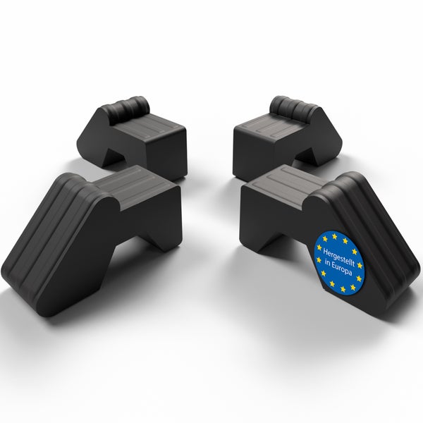 Vier schwarze Unterlegkeile mit dem Siegel Hergestellt in Europa