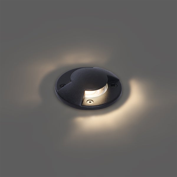 LED Bodeneinbauleuchte rund in Schwarz für den Außenbereich mit warmweißem Licht.