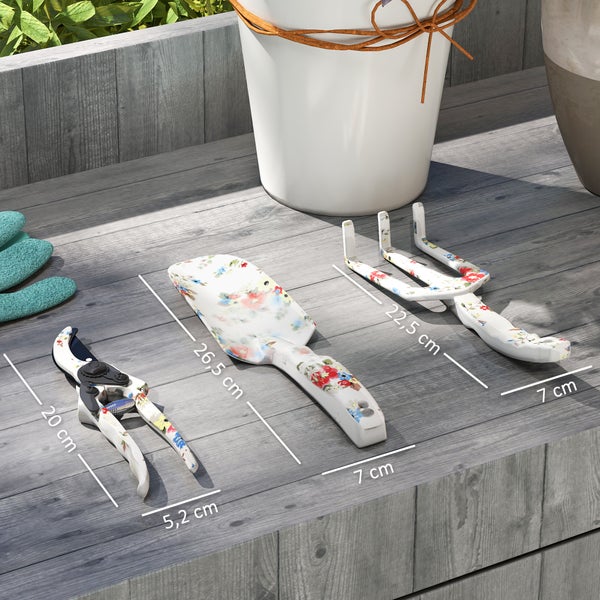 Gartenszene mit einer 20 Zentimeter Gartenschere, einer 26,5 Zentimeter Pflanzschaufel und einer 22,5 Zentimeter Gartenkralle mit Blumenmuster