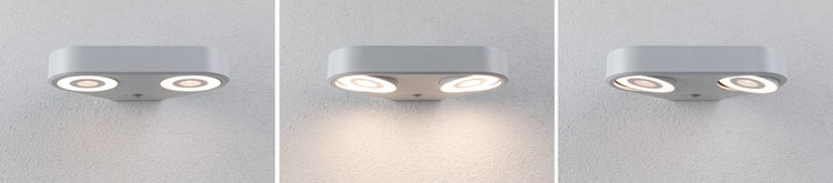 Moderne LED-Wandleuchte mit zwei verstellbaren runden Strahlern, dargestellt in drei verschiedenen Ausrichtungen an einer Wand.