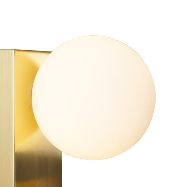 Goldfarbene Wandleuchte mit runder Lichtquelle.