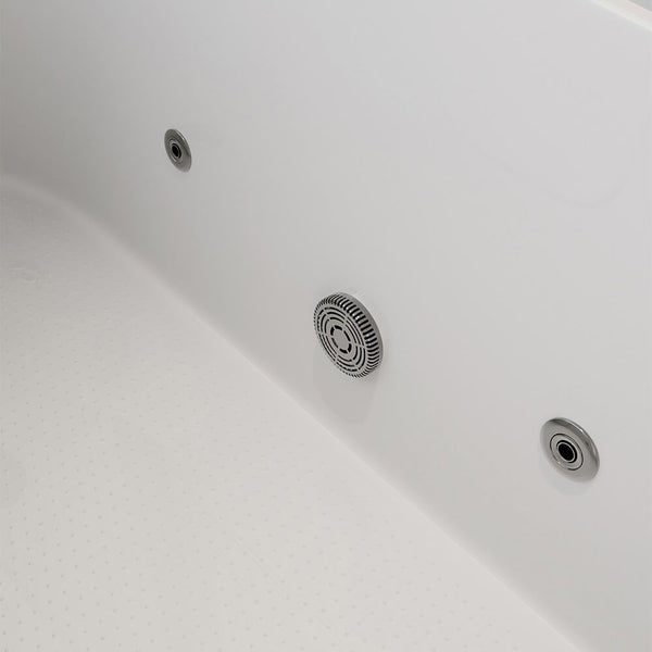 Detailansicht einer Whirlpoolwanne mit Massagedüsen und Ansaugsieb im Innenbereich.