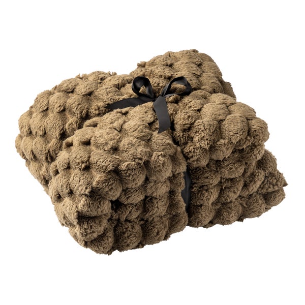 Gefaltete Wohndecke aus strukturiertem Fleece in Taupe, mit schwarzer Schleife gebunden.