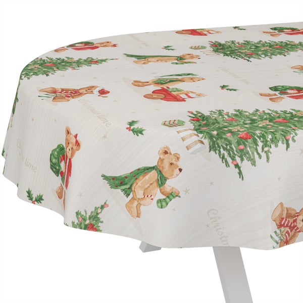 Runde Tischdecke mit Weihnachtsmotiven wie Teddybären, Weihnachtsbäumen und Geschenken.