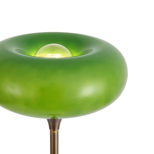 Moderne Stehleuchte mit ringförmigem Glasschirm und integriertem Leuchtmittel auf einem metallischen Standfuß