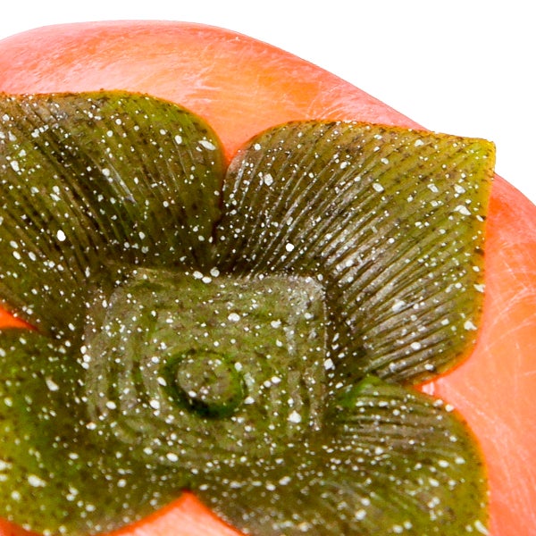 Nahaufnahme einer Wachsblume auf einer Kerze