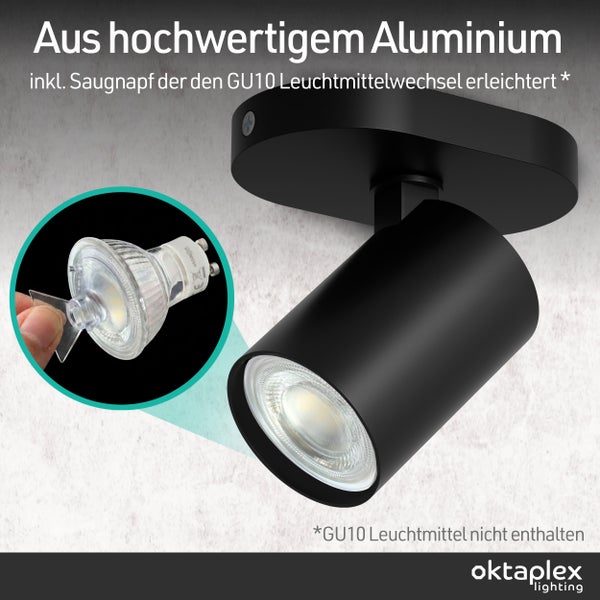 Schwarzer Deckenstrahler aus Aluminium mit zylindrischem Kopf. Inklusive Saugnapf zum Wechseln des GU10 Leuchtmittels. oktaplex lighting Logo.