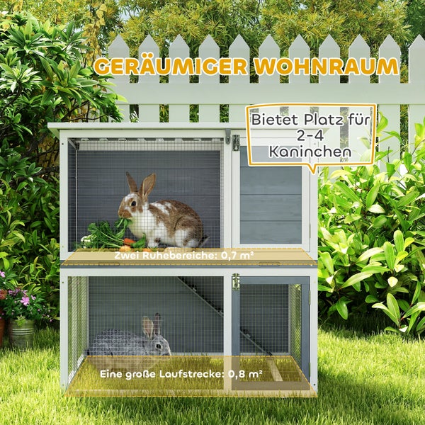 Zweistöckiger Kaninchenstall aus Holz für den Garten mit zwei Ruhebereichen und einem großzügigen Auslauf für zwei bis vier Kaninchen.