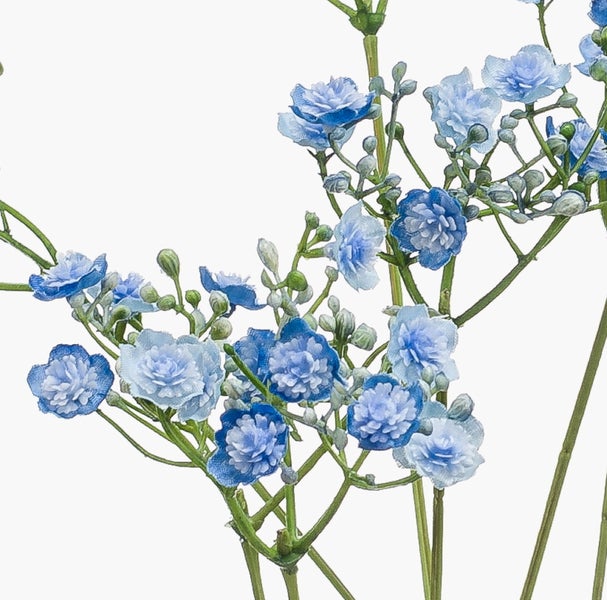 Detailansicht einer künstlichen Pflanze mit langen grünen Blättern und mit Naturbast fixierten Haltestäben.