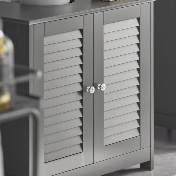 Grauer Badezimmerschrank mit Lamellentüren und runden Griffen