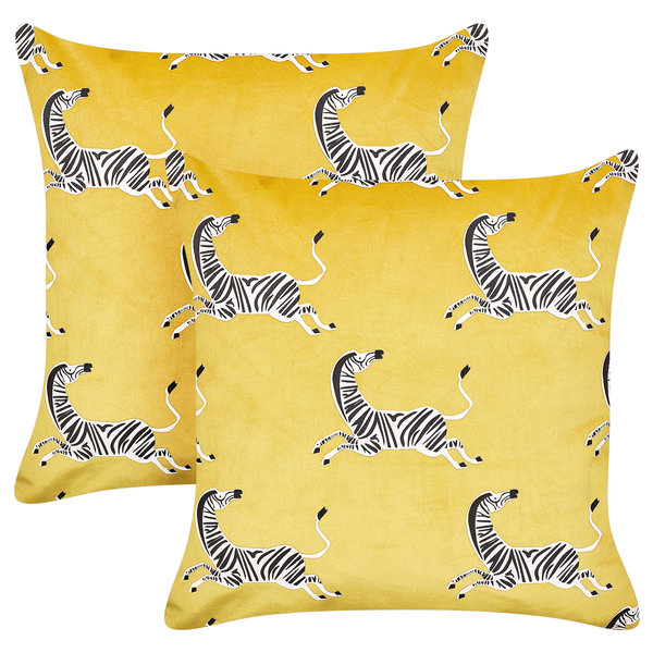 Zwei gelbe Dekokissen mit Zebra-Muster.