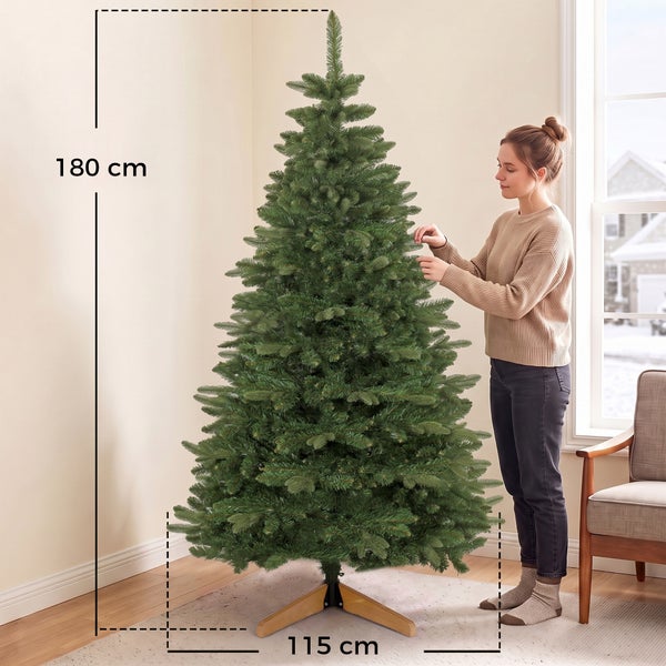 Künstlicher Weihnachtsbaum mit 180 Zentimeter Höhe und 115 Zentimeter Durchmesser, aufgestellt in einem Wohnraum.
