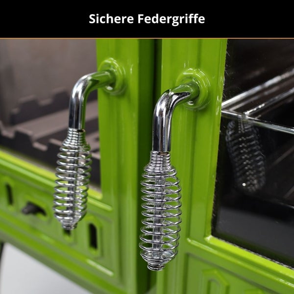 Zwei metallene Federgriffe an einer grünen Smokertür.