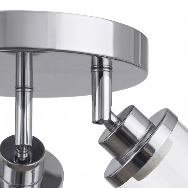 Detailansicht einer verstellbaren Deckenlampe mit Metallgehäuse und Glasschirmen