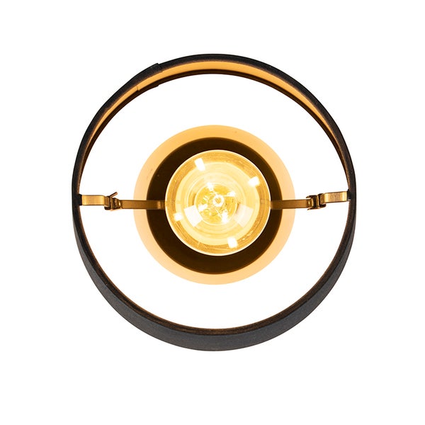 Draufsicht einer modernen Leuchte mit rundem schwarzen Rahmen, goldener Halterung und leuchtendem Leuchtmittel.