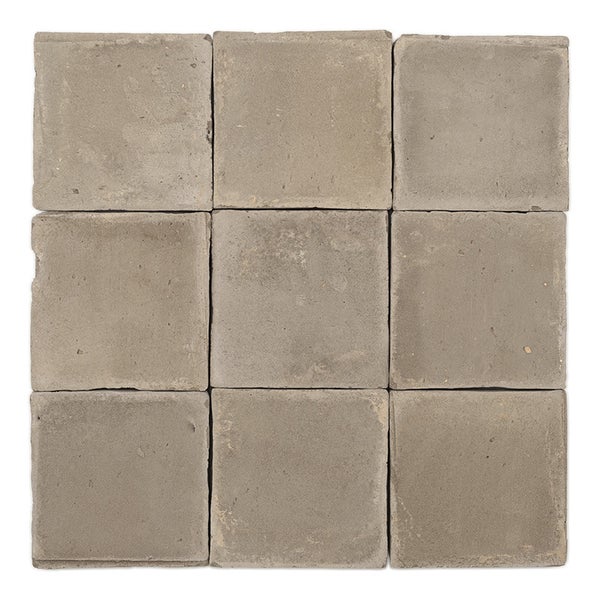 Neun quadratische Wandfliesen aus Beton in einer Anordnung von drei mal drei Fliesen.