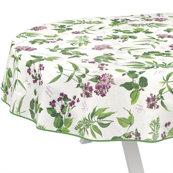 Runde Tischdecke mit botanischem Muster aus lila Blüten und grünen Blättern sowie einem grünen Rand.