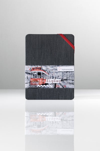 Hahnemühle The ZigZag Book, Leporello-Skizzenbuch mit 18 Seiten, 300 Gramm pro Quadratmeter Papier, schwarzem Einband und rotem Gummiband.