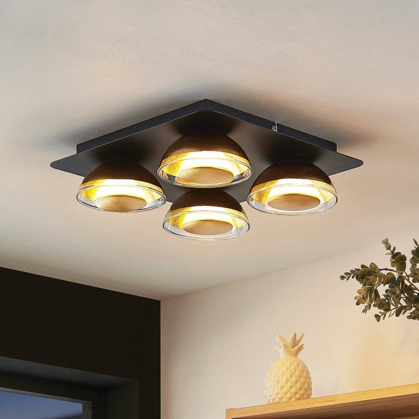 Deckenleuchte mit vier Leuchten unter einer quadratischen, dunklen Platte