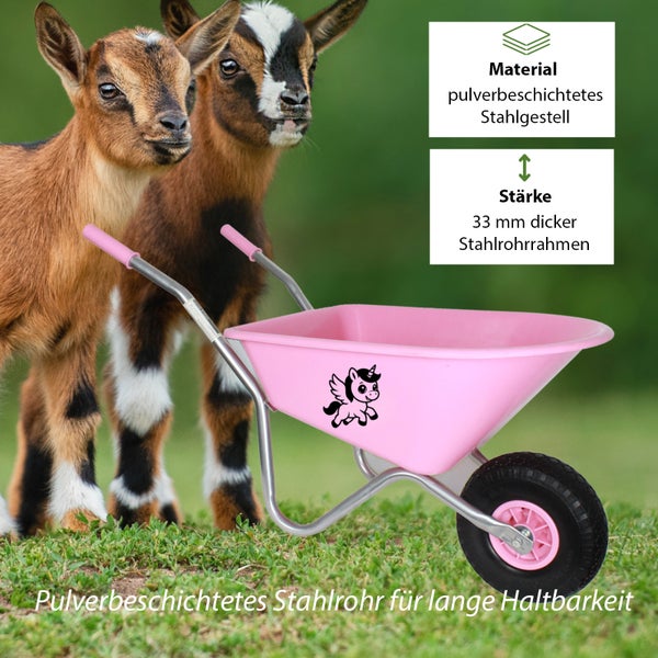 Rosa Kinder-Schubkarre mit Einhorn-Motiv und 33 Millimeter dickem, pulverbeschichtetem Stahlrohrrahmen auf einer Wiese mit Ziegen.