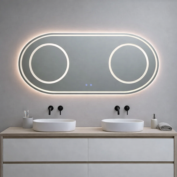 Moderner ovaler LED-Badezimmerspiegel über einem Doppelwaschtisch mit zwei kreisförmigen Lichtzonen und Hintergrundbeleuchtung.