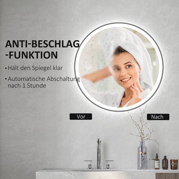 Modernes Badezimmer mit runden Spiegel, Waschtisch und Badewanne
