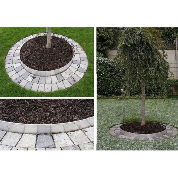 Runde Baumeinfassung aus Metall im Garten mit Rindenmulch und Pflastersteinen auf einer Rasenfläche.