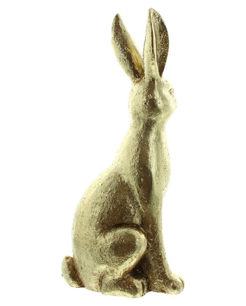 Dekorativer goldener Hase als Osterdekoration