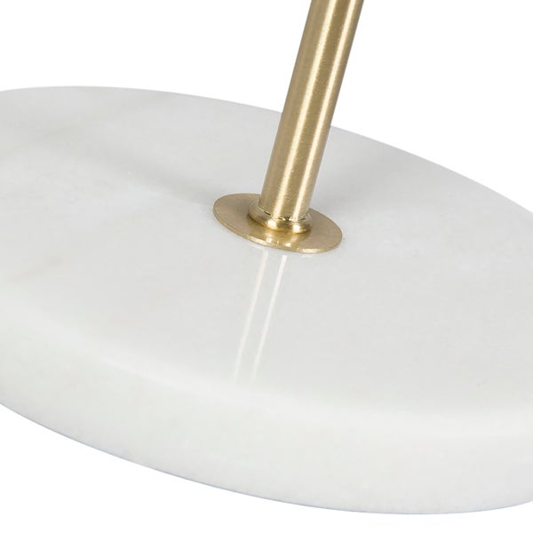 Detailaufnahme eines Lampenfußes aus Marmor mit Metallelementen