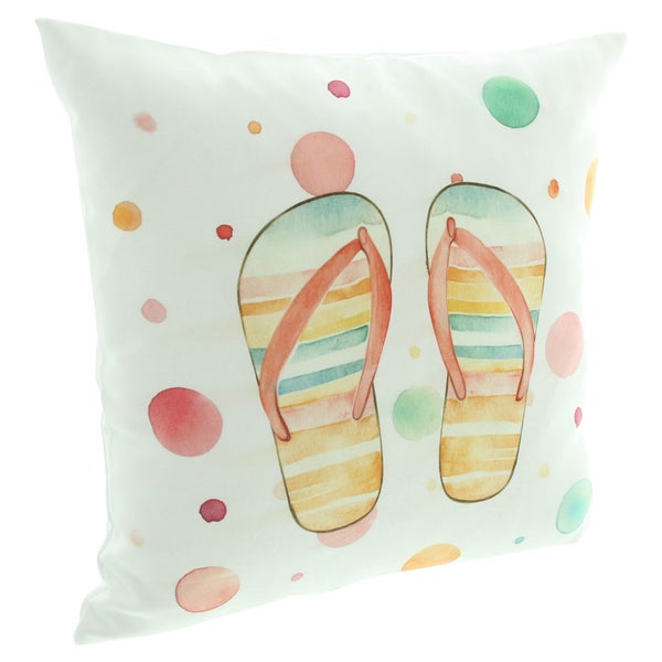 Dekokissen mit buntem Aquarell-Motiv von Flip-Flops und Kreisen.