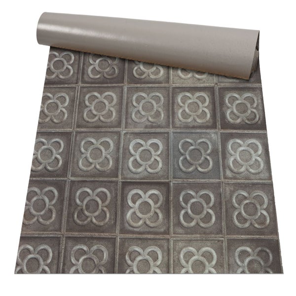 Vinyl-Bodenbelag in Fliesenoptik mit Blumenmuster und Steindesign, teilweise ausgerollt.
