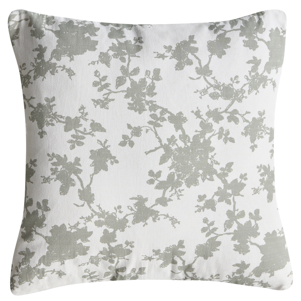 Quadratisches Dekokissen mit floralem Muster aus Zweigen und Blüten.