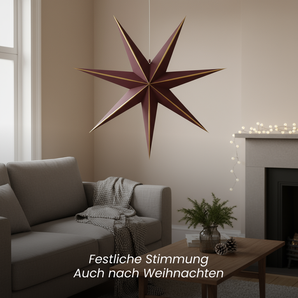 Dekorativer Stern als festliche Raumbeleuchtung im Wohnzimmer.