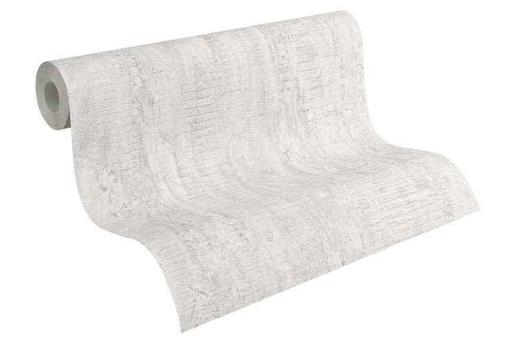 Nahaufnahme eines Holztisches mit einer Pflanze im Topf und Büchern