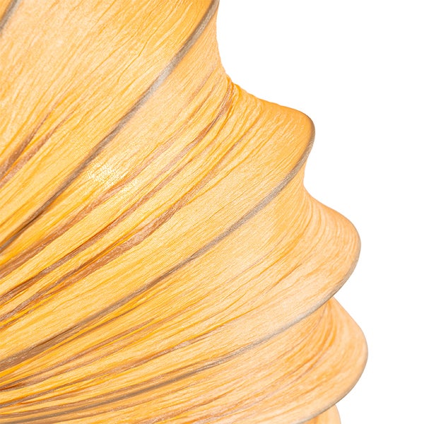 Detailaufnahme eines gewellten Lampenschirms aus strukturiertem Material.