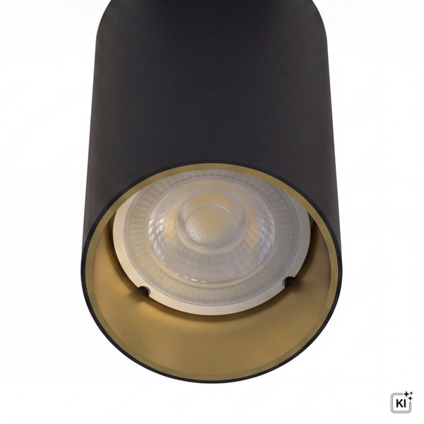 Zylindrische LED Aufbauleuchte mit Lichtquelle und goldener Innenseite.