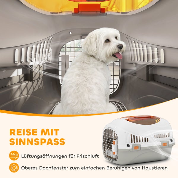 Transportbox für Haustiere mit weißem Hund, Lüftungsschlitzen für Frischluft und oberem Dachfenster zum Beruhigen.